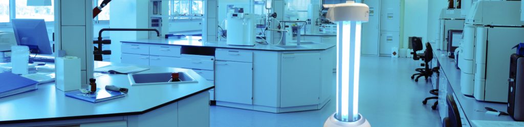 RUVi UVC disinfection robot operating in a medical lab room with lab benches and devices