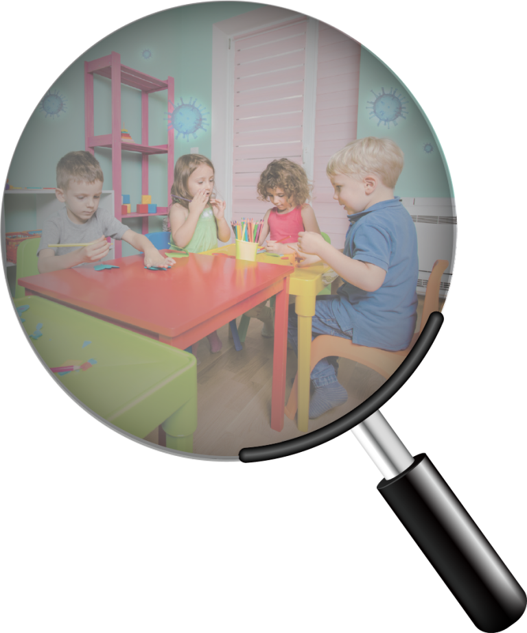 Children sitting around a table in a daycare centre, with virus particles visible under magnification to represent virus transmission indoors.