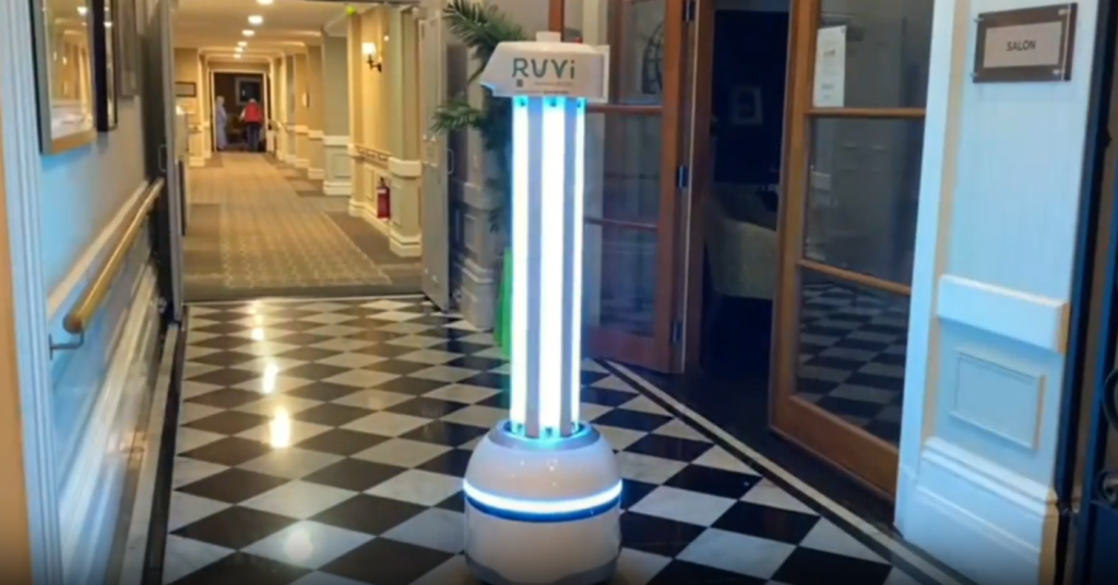 UVC disinfection robot sanitising a hallway in a healthcare facility