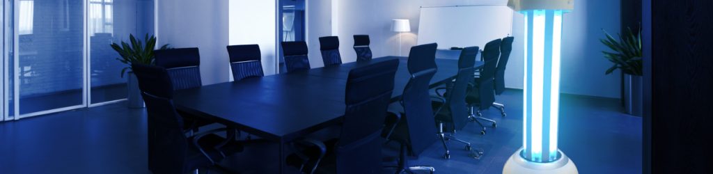 RUVi UVC disinfection robot placed in a modern office boardroom to reduce virus transmission in shared workspaces
